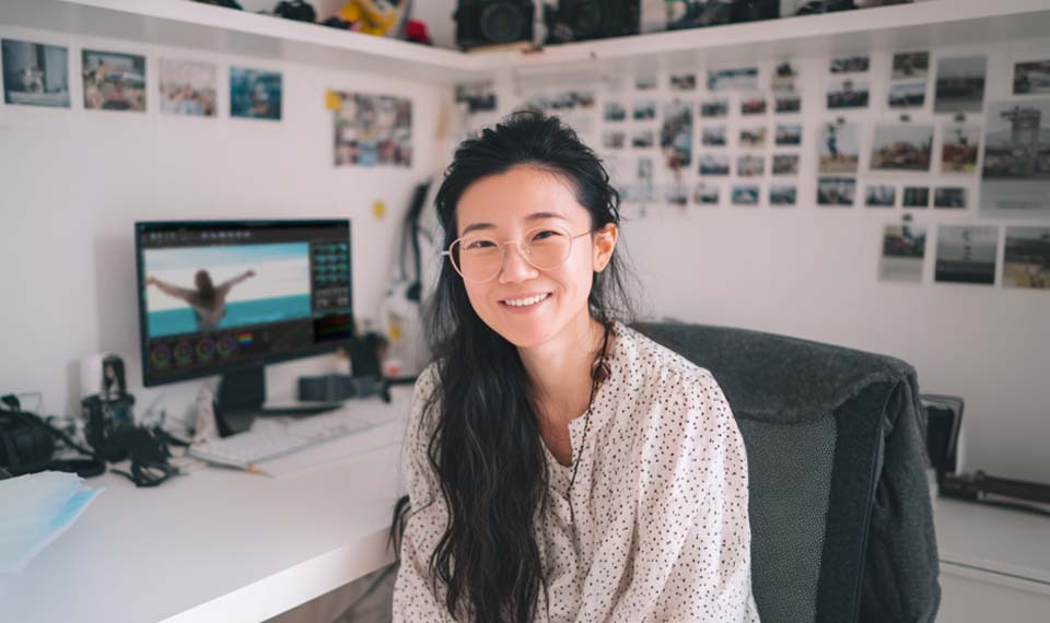 Amy Shao editing travel vlog in VSDC Free Video Editor on Windows laptop